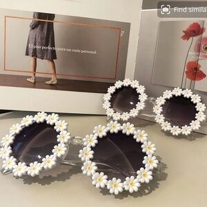 BRAND NEW Adult round Daisy sunglasses with gray lenses. These are super fun.